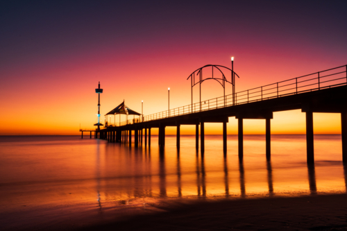 Vibrant Twilight over the Iconic Brighton Jetty in Adelaide, South Australia - Australian Stock Image