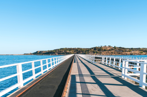 Victor Harbour to Granite Island new causeway viewed from the mainland on a day - Australian Stock Image