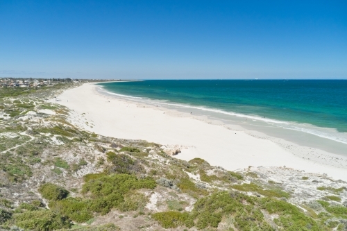 View across the dune and sandy beach at Mullaloo Beach in Perth, Western Australia. - Australian Stock Image