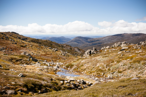 view across the valleys on the Kosciuszko walk near the summit of Thredbo in Snowy Mountains - Australian Stock Image