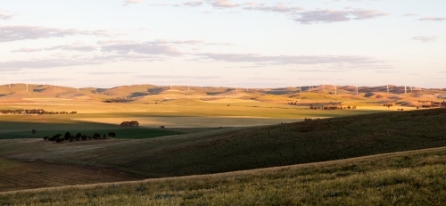 view across valley to wind turbines - Australian Stock Image