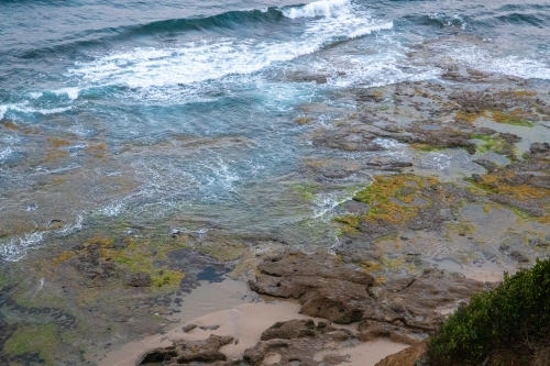 View down to rocky shelves along coastline - Australian Stock Image