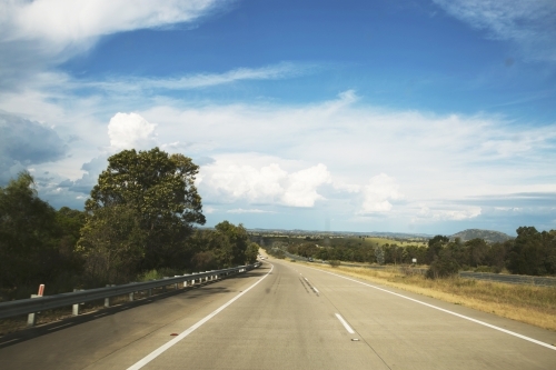 View from out the front of a car, of highway in country area - Australian Stock Image