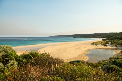 View of beach and ocean from top of sand dune - Australian Stock Image