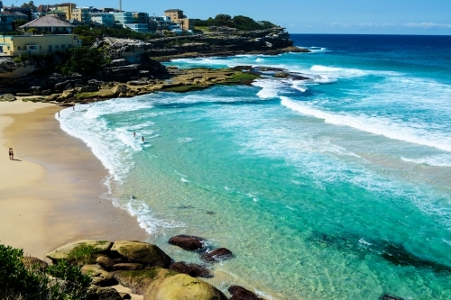 View of beach with nice blue and green ocean - Australian Stock Image