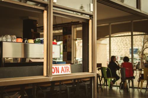 View of Coffee Machine and People in a Cafe