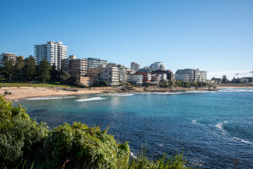 View of Cronulla beach from the esplanade on a sunny morning - Australian Stock Image