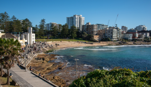 View of Cronulla beach from the esplanade on a sunny morning - Australian Stock Image