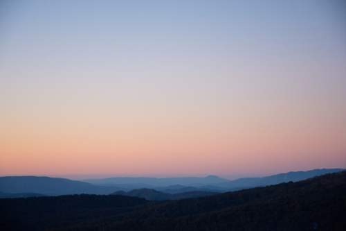 View of mountain range at sunset with coloured sky - Australian Stock Image