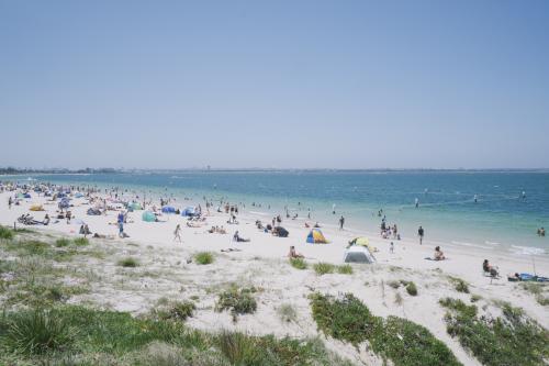 View of people enjoying a summers day at the beach
