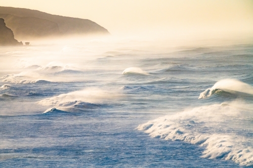 View of powerful oceans waves in the early morning light