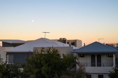 View of sunset over roof tops - Australian Stock Image