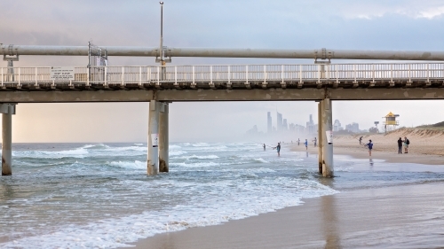 View of surfers paradise through sand pumping jetty at The Spit