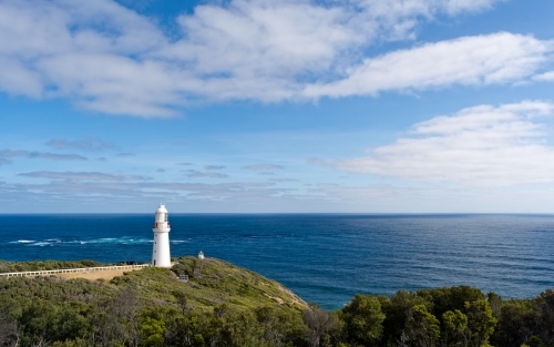 View of the Cape Otway Lighthouse against a ocean and sky backdrop