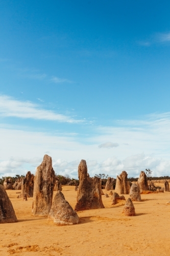 view of the Pinnacles in WA orange sand under blue sky - Australian Stock Image