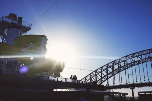 View of the Sydney Harbour Bridge with a cruise ship in the foreground