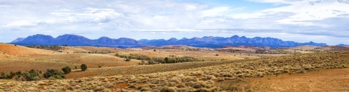 View of Wilpena Pound across rolling hills - Australian Stock Image