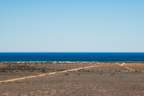 View on top of the escarpment looking towards the blue ocean, Eucla, Western Australia - Australian Stock Image