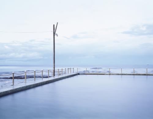 View out to sea over calm ocean pool - Australian Stock Image