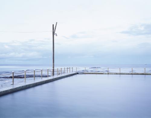 View out to sea over calm ocean pool