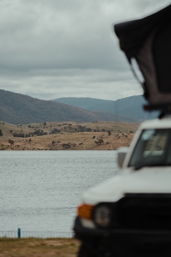 View over Lake Jindabyne while camping on overcast day - Australian Stock Image