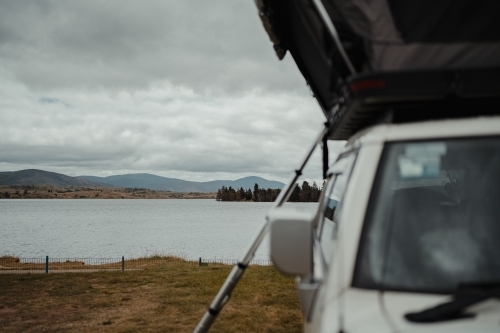 View over Lake Jindabyne while camping on overcast day - Australian Stock Image