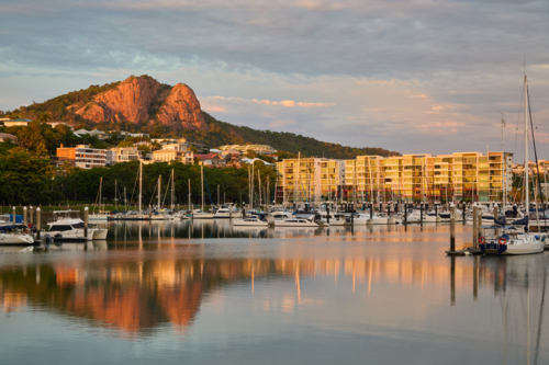 View over marina with boats towards Castle Hill, Townsville - Australian Stock Image