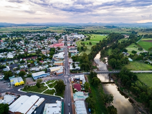 View over riverside country town in NSW Australia at dusk looking down main street John Street - Australian Stock Image