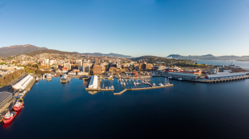 View towards Mt Wellington over the wharf area and CBD in Hobart, Tasmania - Australian Stock Image