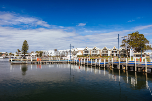 Views around Metung Wharf on a warm sunny spring day in Victoria, Australia - Australian Stock Image