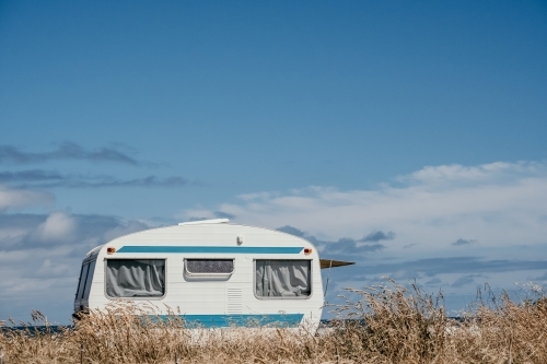 Vintage Caravan against a blue sky.