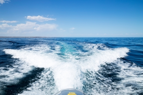 wake behind boat heading out to sea - Australian Stock Image