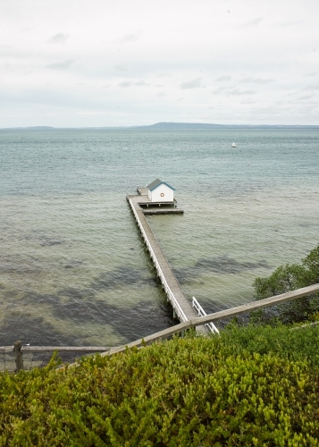 Walkway leading to private jetty and boat shed