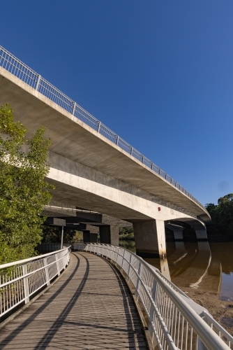 Walkway under motorway bridge crossing the Brunswick River - Australian Stock Image