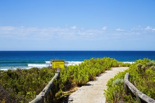 Warning sign on path leading to beach - Australian Stock Image