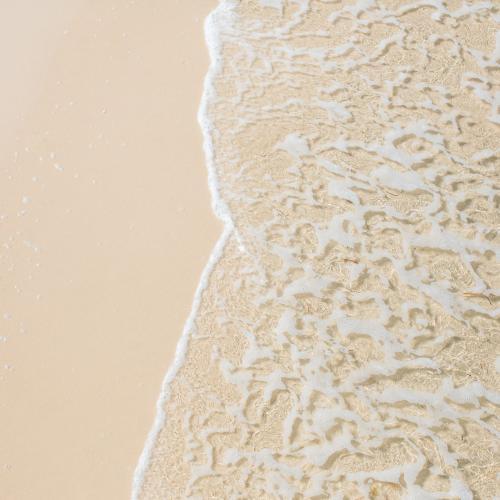Water on a sandy beach - Australian Stock Image