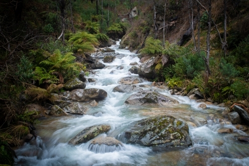 Water rapids coming down along the river - Australian Stock Image