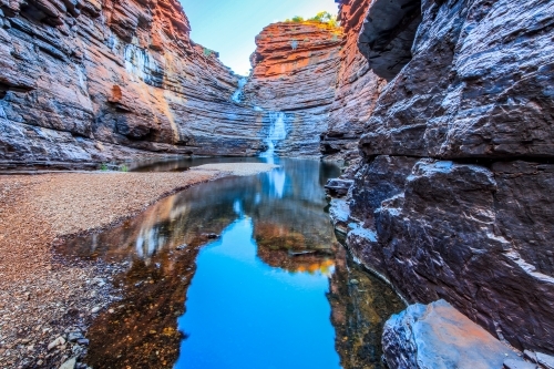 Waterfall and pool at bottom of rocky gorge - Australian Stock Image