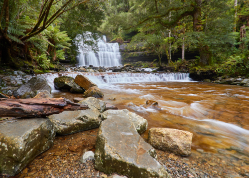 Waterfall with rocks in foreground. - Australian Stock Image