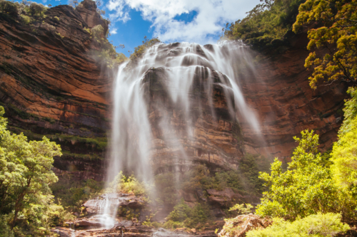 Waterfalls cascading over rocks in Wentworth Falls, New South Wales, Australia - Australian Stock Image