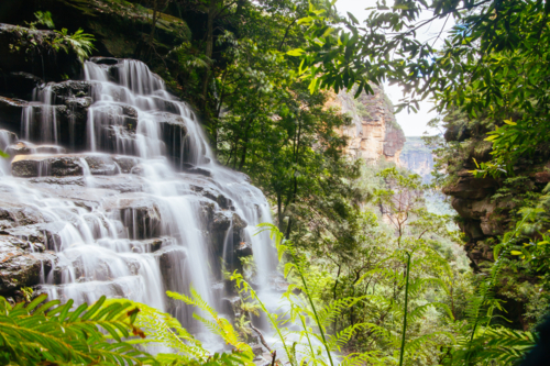 Waterfalls cascading over rocks in Wentworth Falls, New South Wales, Australia - Australian Stock Image