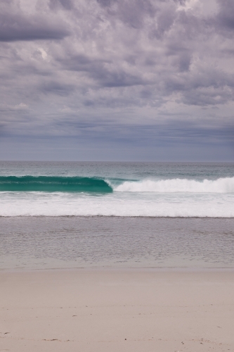 Wave breaking at 10 Mile Lagoon - Australian Stock Image
