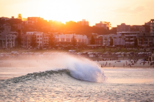 Wave crashing at sunset at Bondi Beach - Australian Stock Image