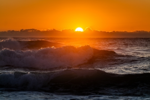 waves and beach at sunrise