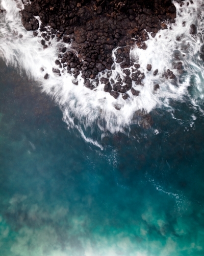 Waves Crashing on a Rocky Beach - Aerial - Australian Stock Image