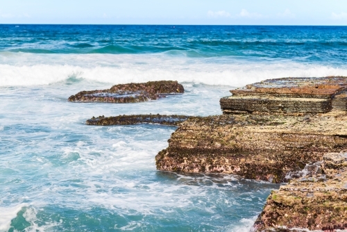 waves crashing on rocks