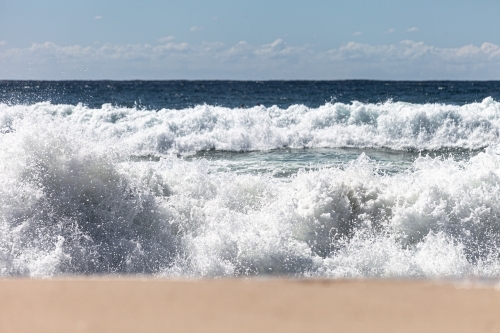 Waves crashing on shore - Australian Stock Image