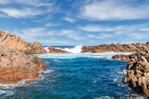 Waves crashing over Canal Rocks Yallingup Western Australia - Australian Stock Image
