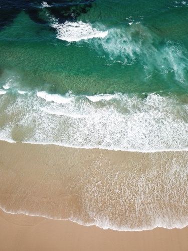 Waves rolling in at Yamba, NSW - Australian Stock Image