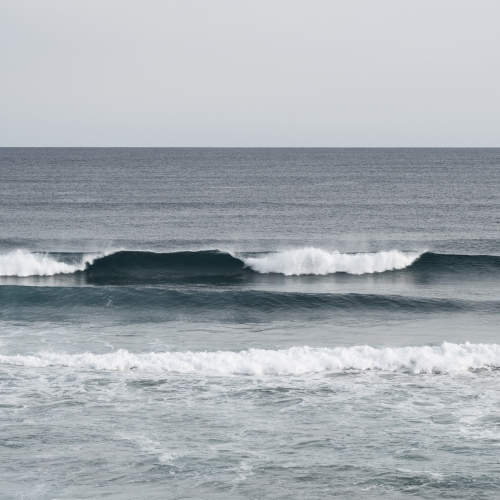 waves rolling in - Australian Stock Image